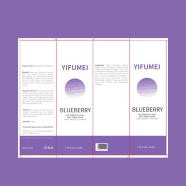 A bottle of blueberry antioxidant cleanser placed on a clean bathroom counter, surrounded by fresh blueberries and green leaves.