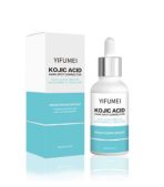 Bottle of kojic acid serum with a dropper placed on a flat surface.